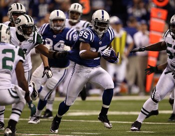 INDIANAPOLIS, IN - JANUARY 08:  Pierre Garcon #85 of the Indianapolis Colts runs for yards after the catch against the New York Jets during their 2011 AFC wild card playoff game at Lucas Oil Stadium on January 8, 2011 in Indianapolis, Indiana. The Jets wo