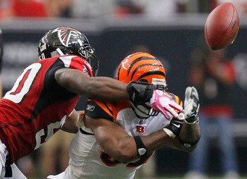 ATLANTA - OCTOBER 24:  Cedric Benson #32 of the Cincinnati Bengals fumbles the ball against Curtis Lofton #50 of the Atlanta Falcons at Georgia Dome on October 24, 2010 in Atlanta, Georgia.  (Photo by Kevin C. Cox/Getty Images)