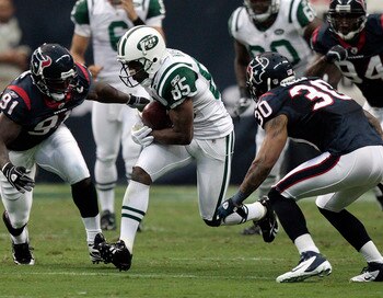 HOUSTON - AUGUST 15:  Wide receiver Derrick Mason #85 of the New York Jets looks for room to run as inside linebacker Tim Dobbins #91 and cornerback Jason Allen #30 of the Houston Texans position for the tackle at Reliant Stadium on August 15, 2011 in Hou