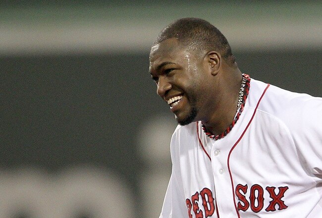 BOSTON, MA - AUGUST 07:  David Ortiz #34 of the Boston Red Sox smiles as he is on second base in the second inning against the New York Yankees on August 7, 2011 at Fenway Park in Boston, Massachusetts.  (Photo by Elsa/Getty Images)