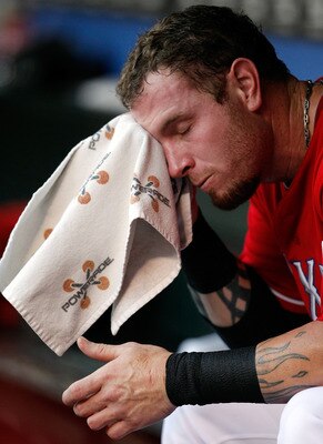 ARLINGTON, TX - AUGUST 22:  Josh Hamilton #32 of the Texas Rangers reacts to the heat as the Rangers take on the Boston Red Sox at Rangers Ballpark in Arlington on August 22, 2011 in Arlington, Texas. The Texas Rangers beat the Boston Red Sox 4-0. (Photo