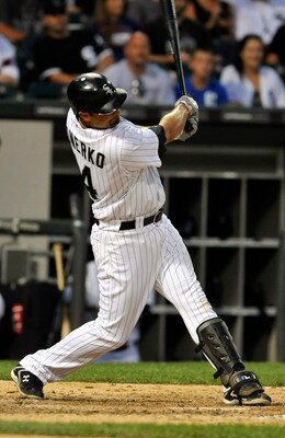 CHICAGO, IL - JULY 30: Paul Konerko #14 of the Chicago White Sox hits a solo home run in the seventh inning against the Boston Red Sox    July 30, 2011 at U.S. Cellular Field in Chicago, Illinois. It was Konerko's 20th homer of the season. (Photo by David