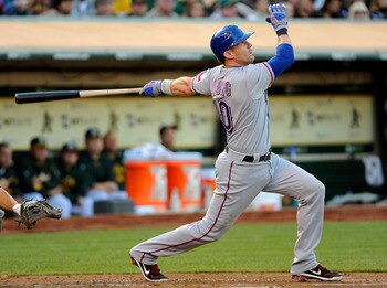 OAKLAND, CA - AUGUST 12: Michael Young #10 of the Texas Rangers watches his ball go off the right field wall for a triple against the Oakland Athletics in the second inning during an MLB baseball game at the O.co Coliseum August 12, 2011 in Oakland, Calif