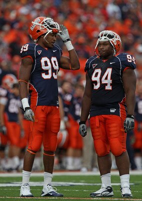 CHAMPAIGN, IL - OCTOBER 02: Michael Buchanan #99 and Akeem Spence #94 of the Illinois Fighting Illini wait during a replay time-out against the Ohio State Buckeyes at Memorial Stadium on October 2, 2010 in Champaign, Illinois. Ohio State defeated Illinois