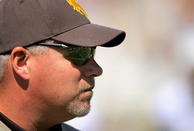 BOULDER, CO - SEPTEMBER 19:  Head coach Dave Christensen of the Wyoming Cowboys prepares to lead his team against the Colorado Buffaloes at Folsom Field on September 19, 2009 in Boulder, Colorado.  (Photo by Doug Pensinger/Getty Images)