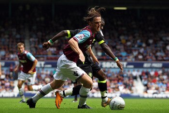 LONDON, ENGLAND - AUGUST 21:  Scott Parker of West Ham and Max-Alain Gradel of Leeds battle for the ball during the npower Championship match between West Ham United and Leeds United at Boleyn Ground on August 21, 2011 in London, England.  (Photo by Dean 