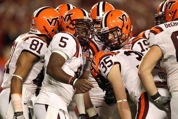 MIAMI, FL - JANUARY 03: Tyrod Taylor #5 of the Virginia Tech Hokies calls a play in the huddle against the Stanford Cardinal during the 2011 Discover Orange Bowl at Sun Life Stadium on January 3, 2011 in Miami, Florida. (Photo by Streeter Lecka/Getty Imag