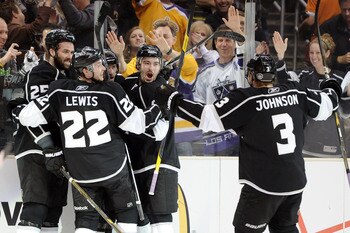 LOS ANGELES, CA - APRIL 25:   The Los Angeles Kings celebrate after a goal by Justin Williams #14 against the San Jose Sharks in the second period of game six of the Western Conference Quarterfinals during the 2011 NHL Stanley Cup Playoffs at Staples Cent