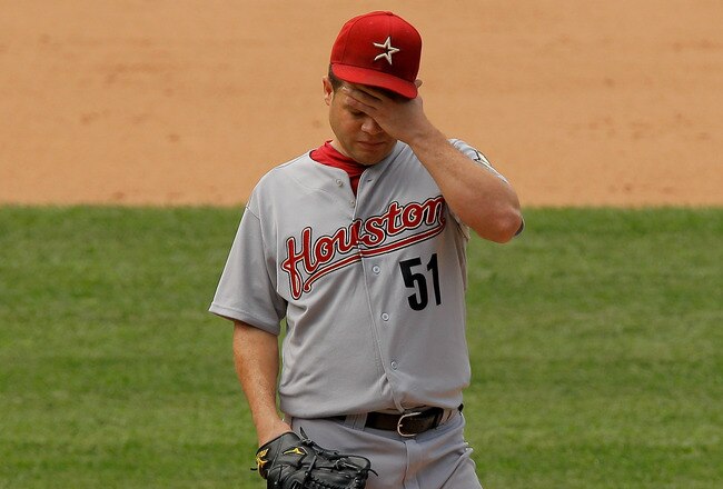 DENVER, CO - AUGUST 24:  Starting pitcher Wandy Rodriguez #51 of the Houston Astros reacts during the fifth inning against the Colorado Rockies at Coors Field on August 24, 2011 in Denver, Colorado. The Rockies defeated the Astros 7-6 in 10 innings.  (Pho