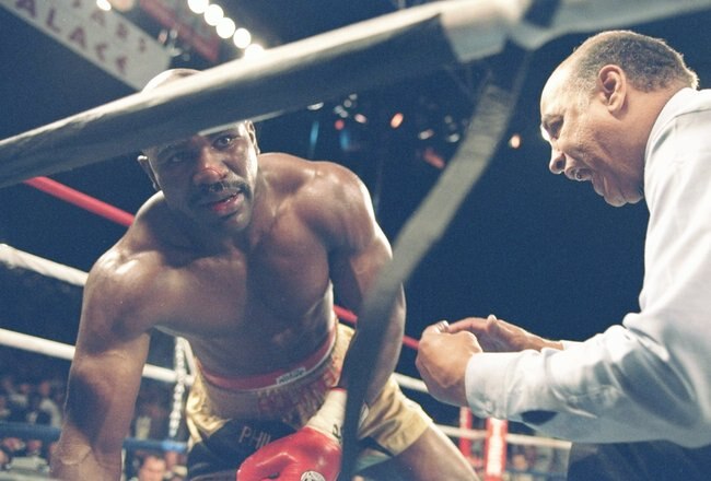 4 Nov 1995:  Evander Holyfield III falls panting during a bout against Riddick Bowe at Caesar''s Palace in Las Vegas, Nevada.  Bowe won the fight with a technical knockout in the eighth round. Mandatory Credit: Al Bello  /Allsport