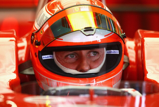 BARCELONA, SPAIN - FEBRUARY 25:  Michael Schumacher of Germany and Ferrari looks on from the pits during day one of the Formula One Testing at the Circuit de Catalunya on February 25, 2008 in Barcelona, Spain.  (Photo by Ryan Pierse/Getty Images)