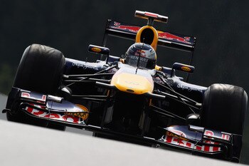 SPA FRANCORCHAMPS, BELGIUM - AUGUST 26:  Sebastian Vettel of Germany and Red Bull Racing drives during practice for the Belgian Formula One Grand Prix at the Circuit of Spa Francorchamps on August 26, 2011 in Spa Francorchamps, Belgium.  (Photo by Mark Th