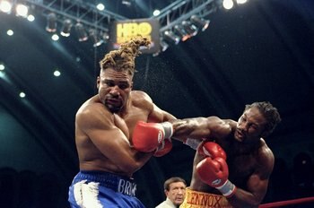28 Mar 1998:  Lennox Lewis (right) in action against Shannon Briggs during their bout at the Caesers Convention Center in Atlantic City, New Jersey.  Lewis won the match with a TKO in the fifth round. Mandatory Credit: Jed Jacobsohn  /Allsport