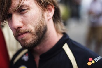 SPA FRANCORCHAMPS, BELGIUM - AUGUST 25:  Nick Heidfeld of Germany and Renault is interviewed in the paddock by the media during previews to the Belgian Formula One Grand Prix at the Circuit of Spa Francorchamps on August 25, 2011 in Spa Francorchamps, Bel