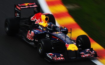 SPA FRANCORCHAMPS, BELGIUM - AUGUST 26:  Sebastian Vettel of Germany and Red Bull Racing drives during practice for the Belgian Formula One Grand Prix at the Circuit of Spa Francorchamps on August 26, 2011 in Spa Francorchamps, Belgium.  (Photo by Lars Ba