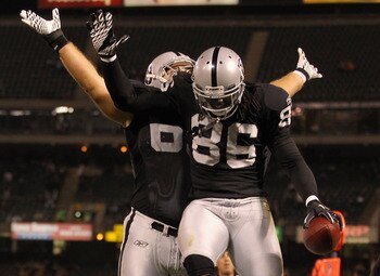 OAKLAND, CA - AUGUST 11:  David Ausberry #86 of the Oakland Raiders celebrates with Alex Parsons #65 of the Oakland Raiders after he scored a touchdown against the Arizona Cardinals at O.co Coliseum on August 11, 2011 in Oakland, California.  (Photo by Ez