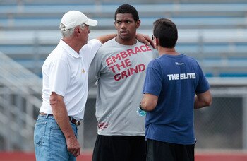 HEMPFIELD TOWNSHIP, PA - AUGUST 20:  Terrelle Pryor talks to quarterbacks coach Ken Anderson and agent Drew Rosenhaus prior to his pro day at a practice facility on August 20, 2011 in Hempfield Township, Pennsylvania.  (Photo by Jared Wickerham/Getty Imag