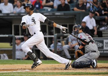 CHICAGO, IL - AUGUST 17:  Alexei Ramirez #10 (L) of the Chicago White Sox follows through on a solo home run as catcher Lou Marson #6 of the Cleveland Indians watches during the second inning at U.S. Cellular Field on August 17, 2011 in Chicago, Illinois.