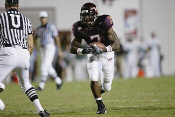 BLACKSBURG, VA - SEPTEMBER 12:  Running back Kevin Jones #7 of the Virginia Tech Hokies runs with the ball during the NCAA football game against the Marshall Thundering Herd at Lane Stadium on September 12, 2002 in Blacksburg, Virgina.  The Hokies defeate