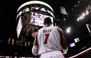 MIAMI, FL - JUNE 12:  Chris Bosh #1 of the Miami Heat looks on against the Dallas Mavericks in Game Six of the 2011 NBA Finals at American Airlines Arena on June 12, 2011 in Miami, Florida. NOTE TO USER: User expressly acknowledges and agrees that, by dow
