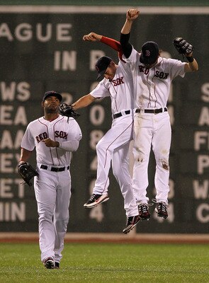BOSTON, MA - AUGUST 27:  Carl Crawford #13 of the Boston Red Sox, Jacoby Ellsbury #2 of the Boston Red Sox, and Josh Reddick #16 of the Boston Red Sox celebrate a 4-0 win over the Oakland Athletics at Fenway Park August 27, 2011 in Boston, Massachusetts.