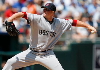 KANSAS CITY, MO - AUGUST 21:  Jon Lester #31 of the Boston Red Sox throws in the second inning during a game against the Kansas City Royals at Kauffman Stadium on August 21, 2011 in Kansas City, Missouri. (Photo by Ed Zurga/Getty Images)