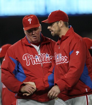 LOS ANGELES, CA - AUGUST 9:  Winning pitcher Cliff Lee #33 of the Philadelphia Phillies is congratulated by manager Charlie Manuel after the game with the Los Angeles Dodgers on August 9, 2011 at Dodger Stadium in Los Angeles, California.  The Phillies wo