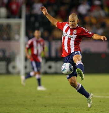 CARSON, CA - AUGUST 27:  Alejandro Moreno #15 of Chivas USA jumps to play the ball in front from Chris Schuler #28 of Real Salt Lake in the second half during the MLS match at The Home Depot Center on August 27, 2011 in Carson, California. Real Salt Lake