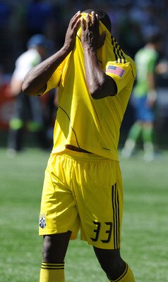 SEATTLE, WA - AUGUST 27: Jeff Cunningham #33 of the Columbus Crew wipes his face with his jersey as he walks off the field after the game against the Seattle Sounders FC at CenturyLink Field on August 27, 2011 in Seattle, Washington. Cunningham scored a g