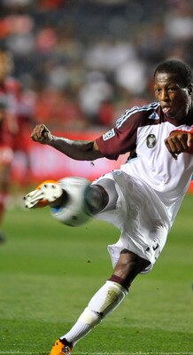 BRIDGEVIEW, IL - AUGUST 27: Sanna Nyassi #23 of the Colorado Rapids and Cory Gibbs # 5 of the Chicago fire fight for the ball in an MLS match on August 27, 2011 at Toyota Park in Bridgeview, Illinois.  (Photo by David Banks/Getty Images)