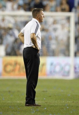 KANSAS CITY, KS - AUGUST 27:  Head coach Peter Vermes looks out onto the field after his team lost 3-2 during the MLS match against the FC Dallas at Livestrong Sporting Park on August 27, 2011 in Kansas City, Kansas. (Photo by Ed Zurga/Getty Images)
