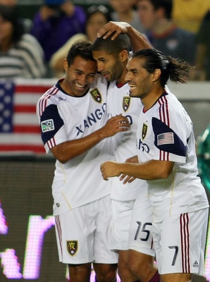 CARSON, CA - AUGUST 27:  Arturo Alvarez #10 and Fabian Espindola #7 of Real Salt Lake celebrate with teammate Alvaro Saborio #15 after Saborio's goal in the first half against Chivas USA during the MLS match at The Home Depot Center on August 27, 2011 in