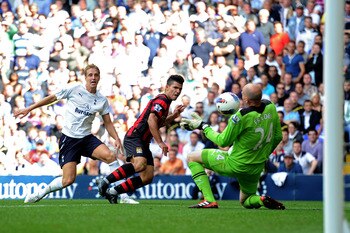LONDON, ENGLAND - AUGUST 28:  Sergio Aguero of Manchester City shoots to score their fourth goal past Brad Friedel of Tottenham during the Barclays Premier League match between Tottenham Hotspur and Manchester City at White Hart Lane on August 28, 2011 in