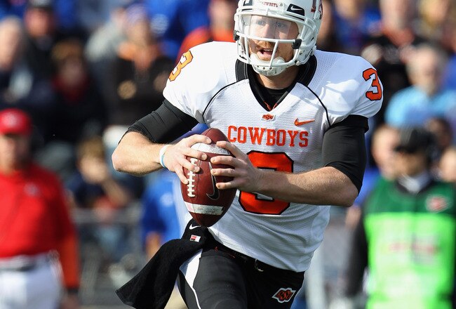 LAWRENCE, KS - NOVEMBER 20:  Quarterback Brandon Weeden #3 of the Oklahoma State Cowboys in action during the game against  the Kansas Jayhawks on November 20, 2010 at Memorial Stadium in Lawrence, Kansas.  (Photo by Jamie Squire/Getty Images)
