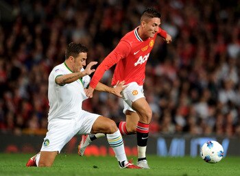 MANCHESTER, ENGLAND - AUGUST 05:   Federico Macheda of Manchester United is challenged by Fabio Cannavaro of New York Cosmos during Paul Scholes' Testimonial Match between Manchester United and New York Cosmos at Old Trafford on August 5, 2011 in Manchest