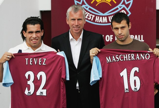 LONDON - SEPTEMBER 05:  (L-R) Carlos Tevez, West Ham manager Alan Pardew and Javier Mascherano pose with their squad numbers during a West Ham United press conference to unveil the new signings at Upton Park on September 5, 2006 in London, England.  (Phot