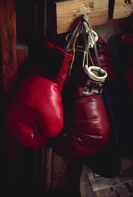 UNDATED:  BOXING GLOVES HANGING ON A NAIL