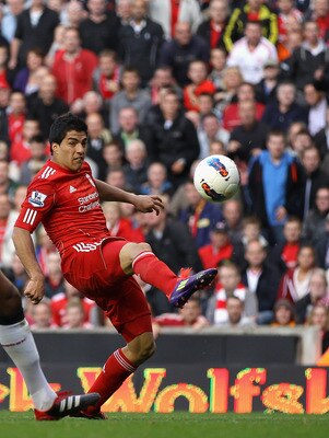 LIVERPOOL, ENGLAND - AUGUST 27:  Luis Suarez of Liverpool attempts a shot at goal during the Barclays Premier League match between Liverpool and Bolton Wanderers at Anfield on August 27, 2011 in Liverpool, England.  (Photo by Clive Brunskill/Getty Images)
