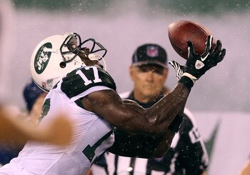 EAST RUTHERFORD, NJ - AUGUST 21:  Plaxico Burress #17 of the New York Jets scores a touchdown against the Cincinnati Bengals during their pre season game on August 21, 2011 at the New Meadowlands Stadium in East Rutherford, New Jersey.  (Photo by Al Bello