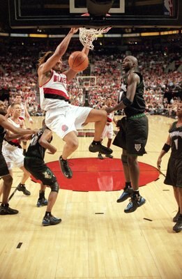 26 Apr 2000: Brian Grant #44 of the Portland Trailblazers makes a slam dunk as he is followed by Kevin Garnett #21of the Minnesota Timberwolves during the NBA Western Conference Playoffs Round One Game at the Rose Garden in Portland, Oregon. The Trailblaz