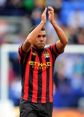 BOLTON, ENGLAND - AUGUST 21:  Carlos Tevez  of Manchester City applauds the fans at the end of the Barclays Premier League match between Bolton Wanderers and Manchester City at the Reebok Stadium on August 21, 2011 in Bolton, England.  (Photo by Michael R