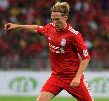 KUALA LUMPUR, MALAYSIA - JULY 16: Christian Poulsen of Liverpool in action during the pre-season friendly match between Malaysia and Liverpool at the Bukit Jalil National Stadium on July 16, 2011 in Kuala Lumpur, Malaysia. (Photo by Stanley Chou/Getty Ima