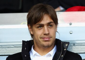 LIVERPOOL, ENGLAND - AUGUST 27:  New Liverpool signing Sebastian Coates looks on ahead of the the Barclays Premier League match between Liverpool and Bolton Wanderers at Anfield on August 27, 2011 in Liverpool, England.  (Photo by Clive Brunskill/Getty Im
