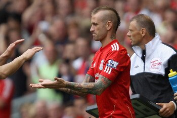 LIVERPOOL, ENGLAND - AUGUST 13:  Luis Suarez of Liverpool is substituted and replaced by Raul Meireles of Liverpool during the Barclays Premier League match between Liverpool and Sunderland at Anfield on August 13, 2011 in Liverpool, England.  (Photo by C
