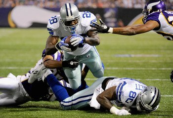 MINNEAPOLIS, MN - AUGUST 27: Felix Jones #28 of the Dallas Cowboys scores against the Minnesota Vikings in the first half on August 27, 2011 at Hubert H. Humphrey Metrodome in Minneapolis, Minnesota. (Photo by Hannah Foslien/Getty Images)