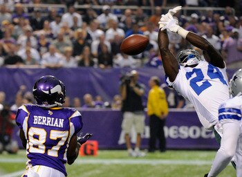 MINNEAPOLIS, MN - AUGUST 27: Bernard Berrian #87 of the Minnesota Vikings catches the ball after an interception attempt by Abram Elam #24 of the Dallas Cowboys in the first half on August 27, 2011 at Hubert H. Humphrey Metrodome in Minneapolis, Minnesota