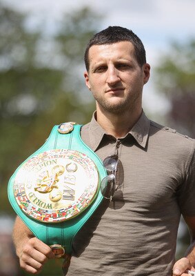BRENTWOOD, ENGLAND - AUGUST 22:  Carl Froch of Great Britain poses with the WBC belt during the Carl Froch and Andre Ward Press Conference at Matchroom Sports Head Office on August 22, 2011 in Brentwood, England.  (Photo by Tom Shaw/Getty Images)
