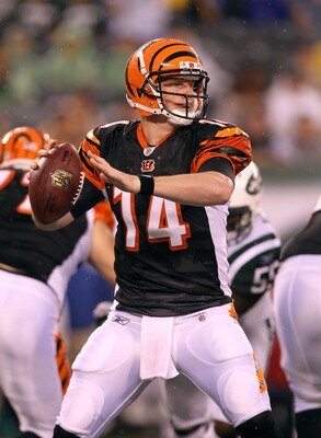 EAST RUTHERFORD, NJ - AUGUST 21:  Andy Dalton #14 of the Cincinnati Bengals looks to pass against the New York Jets during their pre season game on August 21, 2011 at the New Meadowlands Stadium in East Rutherford, New Jersey.  (Photo by Al Bello/Getty Im