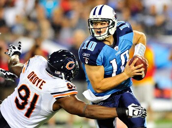 NASHVILLE, TN - AUGUST 27:  Jake Locker #10 of the Tennessee Titans is sacked by Amobi Okoye #91 of the Chicago Bears during a preseason game at LP Field on August 27, 2011 in Nashville, Tennessee. Tennessee defeated Chicago, 14-13.  (Photo by Grant Halve