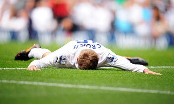 LONDON, ENGLAND - AUGUST 28:  Peter Crouch of Tottenham lies on the ground dejected after seeing his effort go wide during the Barclays Premier League match between Tottenham Hotspur and Manchester City at White Hart Lane on August 28, 2011 in London, Eng